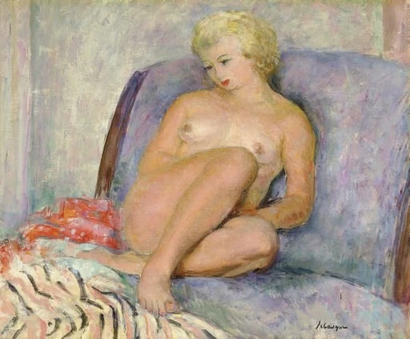 Nuda seduta sul letto